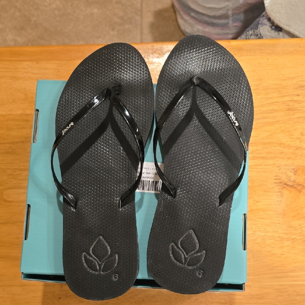 Reef Black Flip Flops with Logo